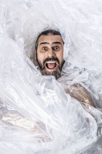 Portrait of man holding plastic screaming