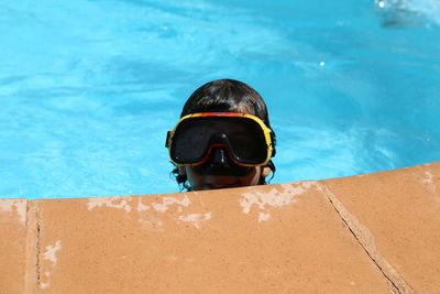 Close-up of boy swimming in pool