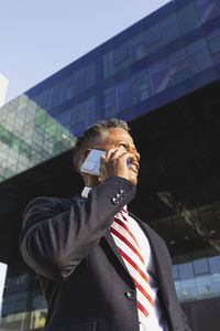 Business man in suit talking on mobile phone