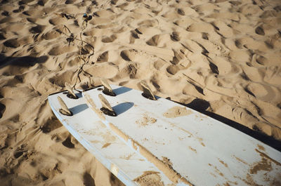 High angle view of garbage on sand