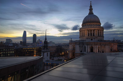 View of buildings against sky at sunset