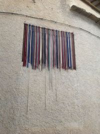 Low angle view of clothes drying on wall