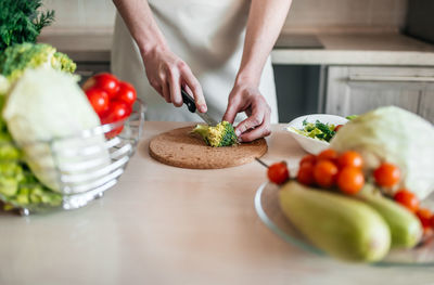 Midsection of man preparing fruits