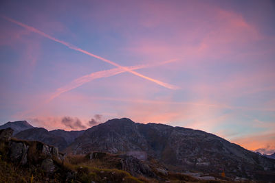 Scenic view of mountains against sky during sunset