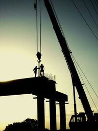 Low angle view of cables against sky