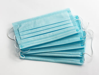 High angle view of blue colored pencils on white table