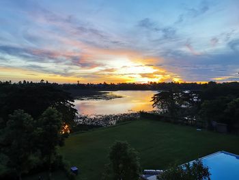 Scenic view of lake against sky during sunset