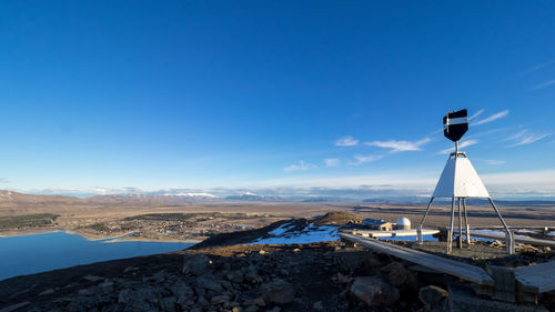 Scenic view of mountains against blue sky