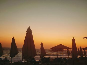 Scenic view of sea against clear sky during sunset