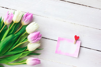High angle view of pink tulips on table