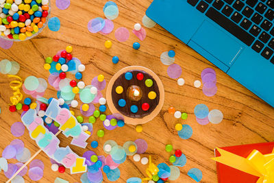 High angle view of multi colored candies on table