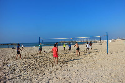 Scenic view of beach against blue sky