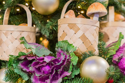 Christmas and new year background. christmas tree decorated with basket with mushrooms and cabbage. 