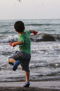 Boy playing at beach