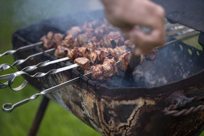 Cropped hand of man preparing food