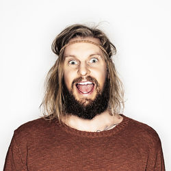 Portrait of smiling mid adult man against white background