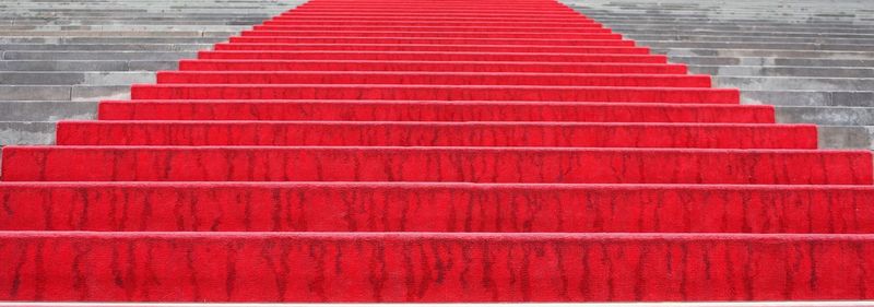 Full frame shot of steps with red carpet