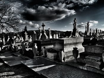 View of cemetery against cloudy sky