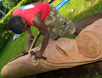 Man working with sculpture