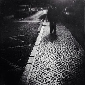 Woman walking on road