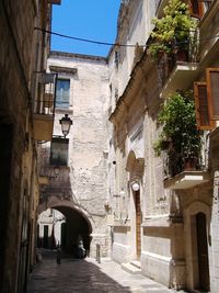 Narrow street leading towards building