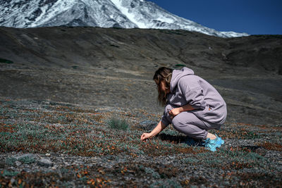 Side view of woman on mountain