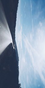 Scenic view of sea and mountains against sky