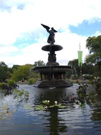 Statue of fountain in front of water