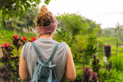 Rear view of woman standing outdoors