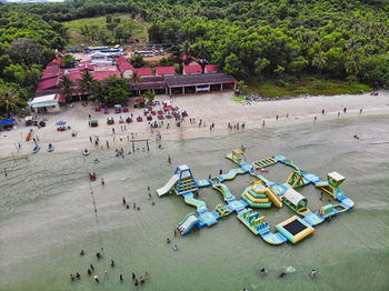 High angle view of people on shore against trees