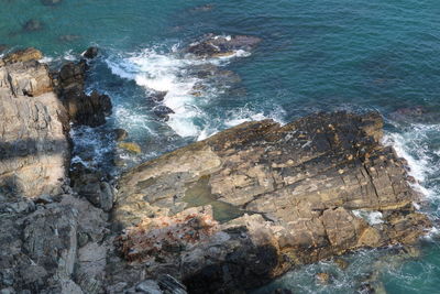 High angle view of rock formation in sea