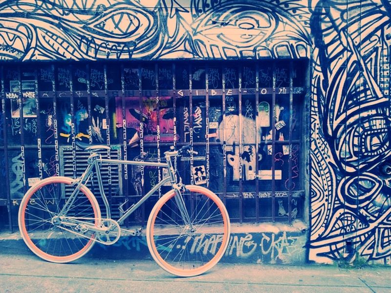 built structure, architecture, graffiti, building exterior, bicycle, wall - building feature, art, art and craft, creativity, day, outdoors, transportation, no people, wall, multi colored, window, railing, gate, stationary, house