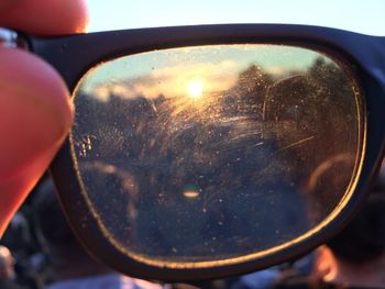 Close-up of wet window during sunset