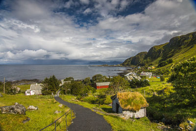 Scenic view of sea and buildings against sky