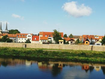 Houses in town against sky