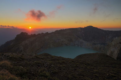 Scenic view of mountains against sky during sunset