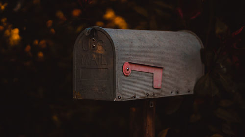 Close-up of mailbox on wood