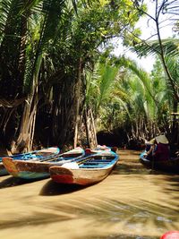 Boats moored on sea shore