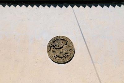 High angle view of coins on wall