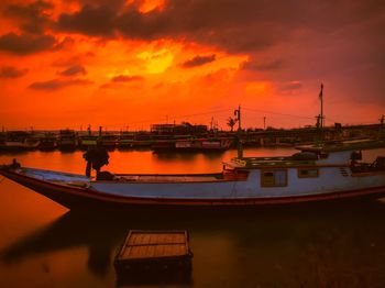 Scenic view of sea against orange sky