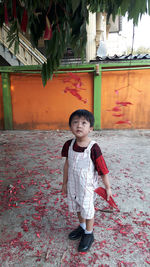 Portrait of cute girl standing outdoors