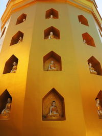 Low angle view of buddha sculpture at mount popa shrine