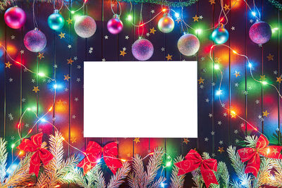 Digital composite image of illuminated christmas lights at night