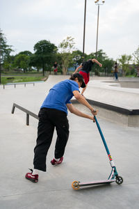 Full length of man skateboarding on skateboard