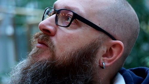 Close-up of bearded man wearing eyeglasses
