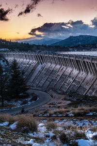 Scenic view of lake against sky during winter