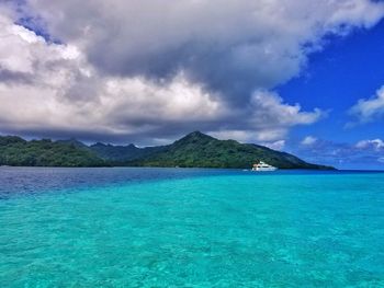 Scenic view of sea against cloudy sky