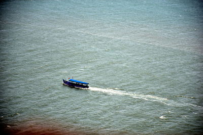 High angle view of ship sailing on sea