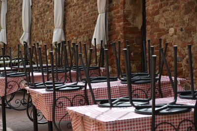 Empty chairs and tables in restaurant