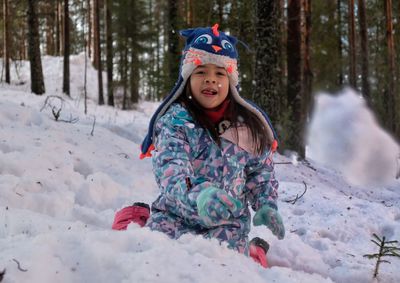 Full length of child in snow during winter